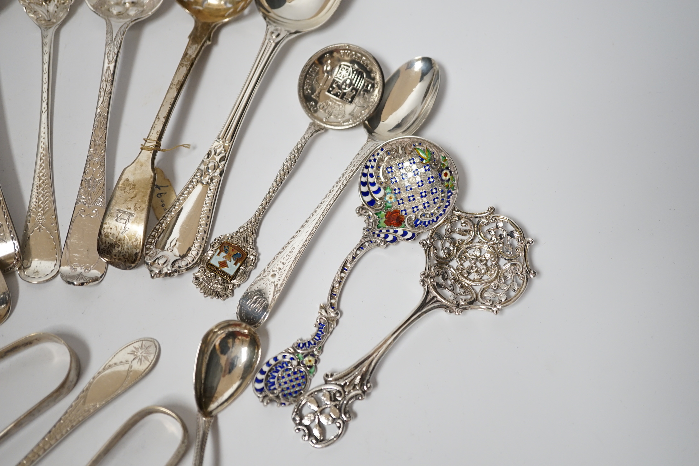 A quantity of assorted 19th century and later silver flatware, various dates and makers including base mark table spoons, berry spoons, sifter spoon etc. together with an Scandinavian 925 and enamelled spoon and a plated
